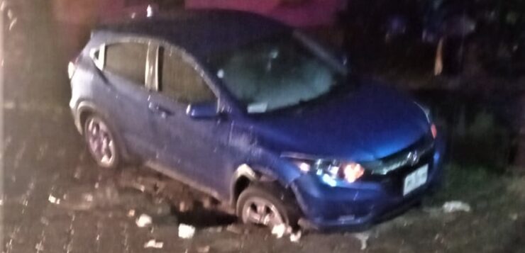 Car stuck in a sinkhole on Juárez Street in Jocotepec