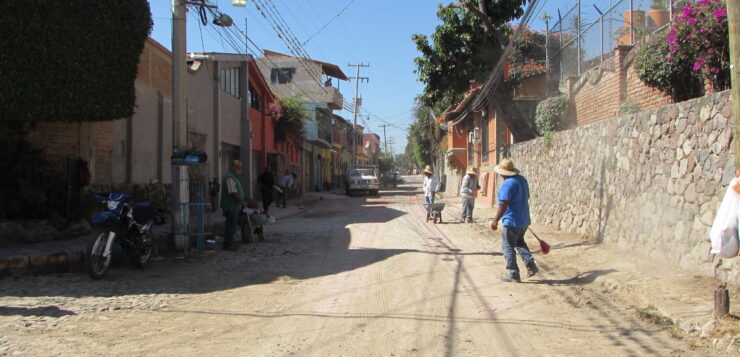 Construction of cobblestone road halted by protest