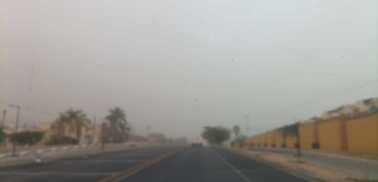 Dust storm invades Jocotepec, blotting out the mountains