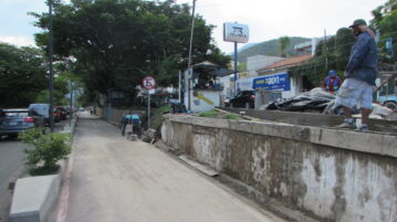 Rain collapses retaining wall, delaying replacement of cut trees