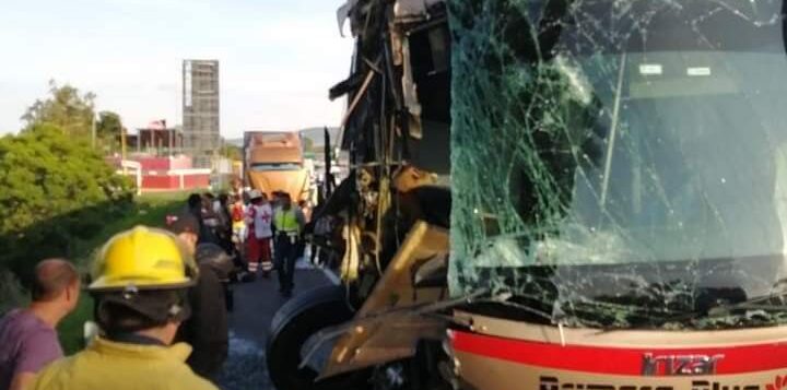 Passenger bus collides with beer truck