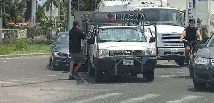 BMW rear ends delivery truck at Walmart intersection