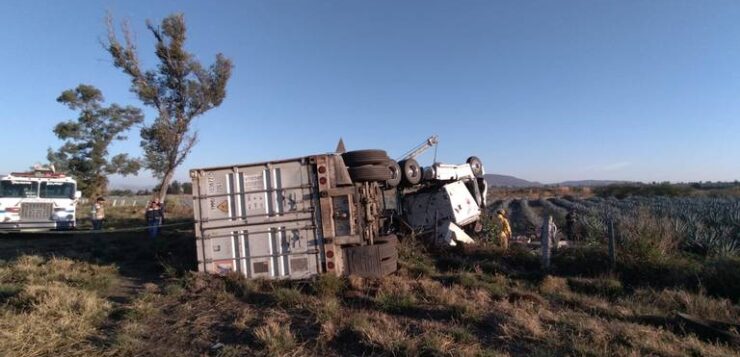 Family of three killed in tractor-trailer rollover